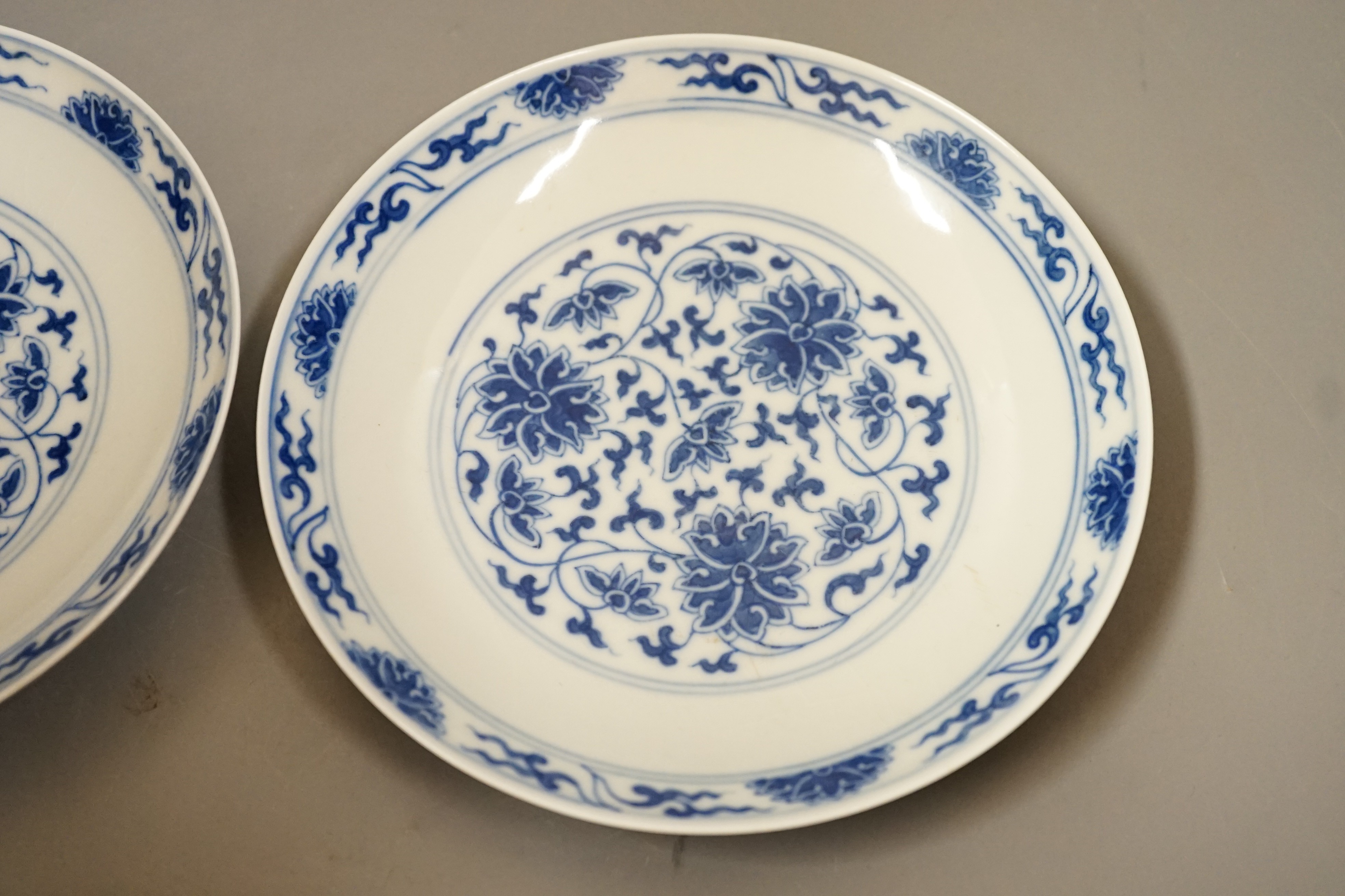 A pair of Chinese blue and 'white lotus' dishes, Qianlong marks, 16.5cms diameter